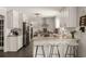 Inviting kitchen with an island, stainless steel appliances, subway tile backsplash, and modern barstools at 503 Duke Dr, Marietta, GA 30066