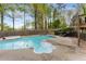 Backyard pool area with mature trees and surrounding fence for added privacy at 503 Duke Dr, Marietta, GA 30066