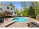 Beautiful backyard pool with diving board, patio, and upper-level deck, perfect for entertaining at 503 Duke Dr, Marietta, GA 30066
