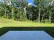 Spacious backyard featuring a concrete patio perfect for outdoor entertaining and relaxing at 657 Egrets Landing #54, Covington, GA 30014