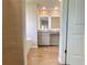 A newly constructed bathroom, showing tile walls, a garden tub, and a vanity at 657 Egrets Landing #54, Covington, GA 30014