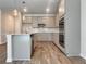 Well-equipped kitchen featuring stainless steel appliances, a center island, and modern gray cabinetry at 657 Egrets Landing #54, Covington, GA 30014
