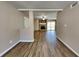 Open living space with wood-look floors that features a stone fireplace at 955 Laurel Mill Dr, Roswell, GA 30076