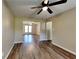 Inviting living space with wood-look floors, neutral paint, and easy access to other areas of the home at 955 Laurel Mill Dr, Roswell, GA 30076