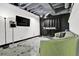 A unique basement space with modern lighting, neutral-tone walls, and a cozy space to relax or entertain at 2451 Cedar Fork Trl, Marietta, GA 30062