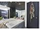 Bright bathroom with jacuzzi tub, modern fixtures, and a robe hanging on the bathroom door at 2451 Cedar Fork Trl, Marietta, GA 30062