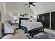 Spacious bedroom featuring a plush bed, a mirrored nightstand, and a ceiling fan at 2451 Cedar Fork Trl, Marietta, GA 30062