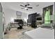 Bright bedroom features a ceiling fan, modern decor, and ample workspace for productivity at 2451 Cedar Fork Trl, Marietta, GA 30062