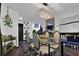 Dining room featuring a glass table, upholstered chairs, and decorative lighting at 2451 Cedar Fork Trl, Marietta, GA 30062