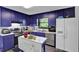 Kitchen with light-colored countertops, blue cabinets, and stainless steel appliances at 2451 Cedar Fork Trl, Marietta, GA 30062