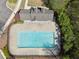 Aerial view of the community pool, featuring a large in-ground pool, sitting area, and pool fencing at 2894 Cross Creek Dr, Cumming, GA 30040
