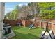 Large backyard featuring green grass, privacy fence, play set, and grill at 2894 Cross Creek Dr, Cumming, GA 30040