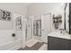 Bright bathroom featuring a separate tub and shower, a modern vanity, and updated fixtures at 2894 Cross Creek Dr, Cumming, GA 30040
