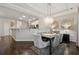 Bright dining room features an elegant chandelier and wainscoting at 2894 Cross Creek Dr, Cumming, GA 30040