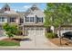 Charming townhouse with a two-car garage and attractive brick and siding exterior at 2894 Cross Creek Dr, Cumming, GA 30040