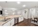 Bright kitchen boasts stainless steel appliances, granite countertops, and an open floorplan at 2894 Cross Creek Dr, Cumming, GA 30040