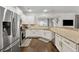 Well lit kitchen with stainless steel appliances, granite countertops, and wood floors at 2894 Cross Creek Dr, Cumming, GA 30040