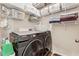 Laundry room featuring a front loading washer and dryer with wire shelving for storage at 2894 Cross Creek Dr, Cumming, GA 30040