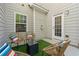 Comfortable outdoor patio featuring decorative seating, privacy fence, and a door into the home at 2894 Cross Creek Dr, Cumming, GA 30040