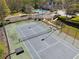 Aerial view of community tennis court plus swimming pool, providing excellent recreation opportunities at 2894 Cross Creek Dr, Cumming, GA 30040