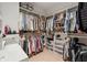 Well-organized walk-in closet with ample shelving, hanging space, and built-in storage solutions at 2894 Cross Creek Dr, Cumming, GA 30040