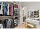 Well-organized walk-in closet with ample shelving and an additional vanity area at 2894 Cross Creek Dr, Cumming, GA 30040