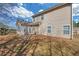 A backyard with a patio, chairs, and a view of the house at 5013 Centennial Commons Nw Dr, Acworth, GA 30102