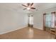 Spacious bedroom featuring hardwood floors, a ceiling fan, and plenty of natural light at 5013 Centennial Commons Nw Dr, Acworth, GA 30102