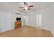 Bright bedroom with hardwood floors, ceiling fan, and a decorative fireplace at 5013 Centennial Commons Nw Dr, Acworth, GA 30102