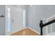 Bright entryway with wood floors, a white door with sidelights, and staircase with dark trim at 5013 Centennial Commons Nw Dr, Acworth, GA 30102