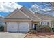 Charming single-story home with brick facade, two-car garage, and well-maintained landscaping at 5013 Centennial Commons Nw Dr, Acworth, GA 30102