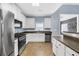 Modern kitchen featuring stainless steel appliances, white cabinetry, and sleek countertops at 5013 Centennial Commons Nw Dr, Acworth, GA 30102