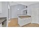 Bright kitchen area showcasing countertops, white cabinetry, and open access to the living area at 5013 Centennial Commons Nw Dr, Acworth, GA 30102