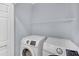 Functional laundry room with modern appliances and ample storage space with a wire shelf at 5013 Centennial Commons Nw Dr, Acworth, GA 30102