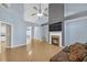 Open living room with vaulted ceilings, fireplace, ceiling fan, and neutral-toned walls at 5013 Centennial Commons Nw Dr, Acworth, GA 30102