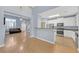 Open-concept living area with access to a modern kitchen and sun-drenched living room at 5013 Centennial Commons Nw Dr, Acworth, GA 30102
