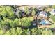 Spacious backyard with mature trees, lush lawn, pool, and separate outbuilding at 60 Bartlett Way, Dallas, GA 30157