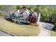 Expansive property featuring a well-manicured lawn, inviting front porch, and long driveway at 60 Bartlett Way, Dallas, GA 30157