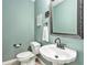 Elegant powder room with a decorative mirror and modern fixtures at 60 Bartlett Way, Dallas, GA 30157