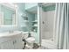 Bathroom featuring tiled floors, shower, sink, and extra storage shelves at 60 Bartlett Way, Dallas, GA 30157