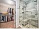 Bathroom features a glass shower, and an open closet with ample storage space at 60 Bartlett Way, Dallas, GA 30157