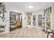 Sunny breakfast nook with access to the deck, views of the living room, and plenty of natural light at 60 Bartlett Way, Dallas, GA 30157