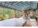 Outdoor deck with a fireplace, seating, and a hot tub at 60 Bartlett Way, Dallas, GA 30157