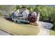 Spacious home showcasing a long driveway, attached garage, large yard and lovely landscaping at 60 Bartlett Way, Dallas, GA 30157