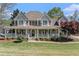 Charming two-story home with a welcoming front porch, manicured lawn, and lovely curb appeal at 60 Bartlett Way, Dallas, GA 30157