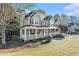Attractive two-story home featuring a spacious porch, a well-kept lawn, and beautiful landscaping at 60 Bartlett Way, Dallas, GA 30157