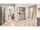 Kitchen area featuring a coffee bar, stainless steel appliances, and tile floors at 60 Bartlett Way, Dallas, GA 30157