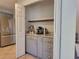 Kitchen featuring a convenient built-in coffee bar with granite counters and stainless steel refrigerator at 60 Bartlett Way, Dallas, GA 30157