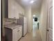 Cozy kitchenette featuring granite counters, modern refrigerator and ample cabinet space at 60 Bartlett Way, Dallas, GA 30157