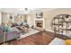 Cozy living room featuring a fireplace, a large sectional, and windows with decorative curtains for added charm at 60 Bartlett Way, Dallas, GA 30157